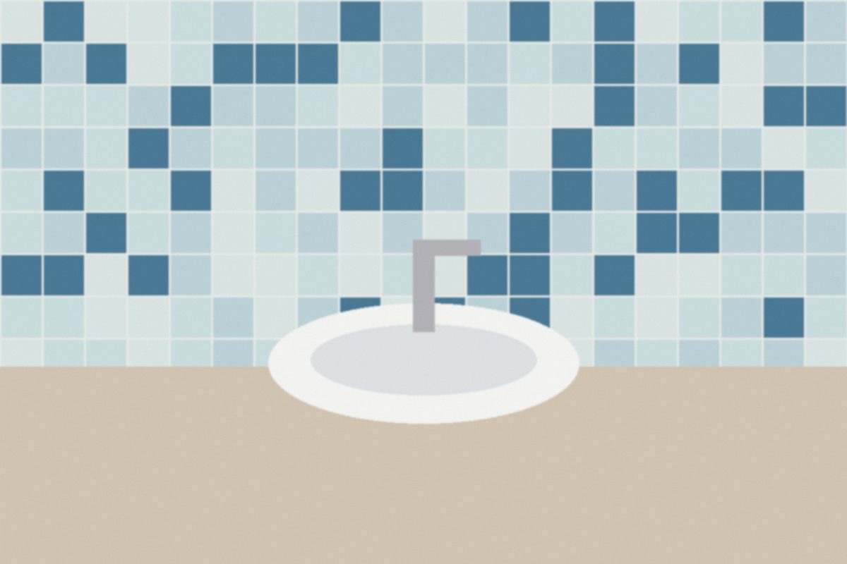 Blue and white tiled bathroom with a round sink